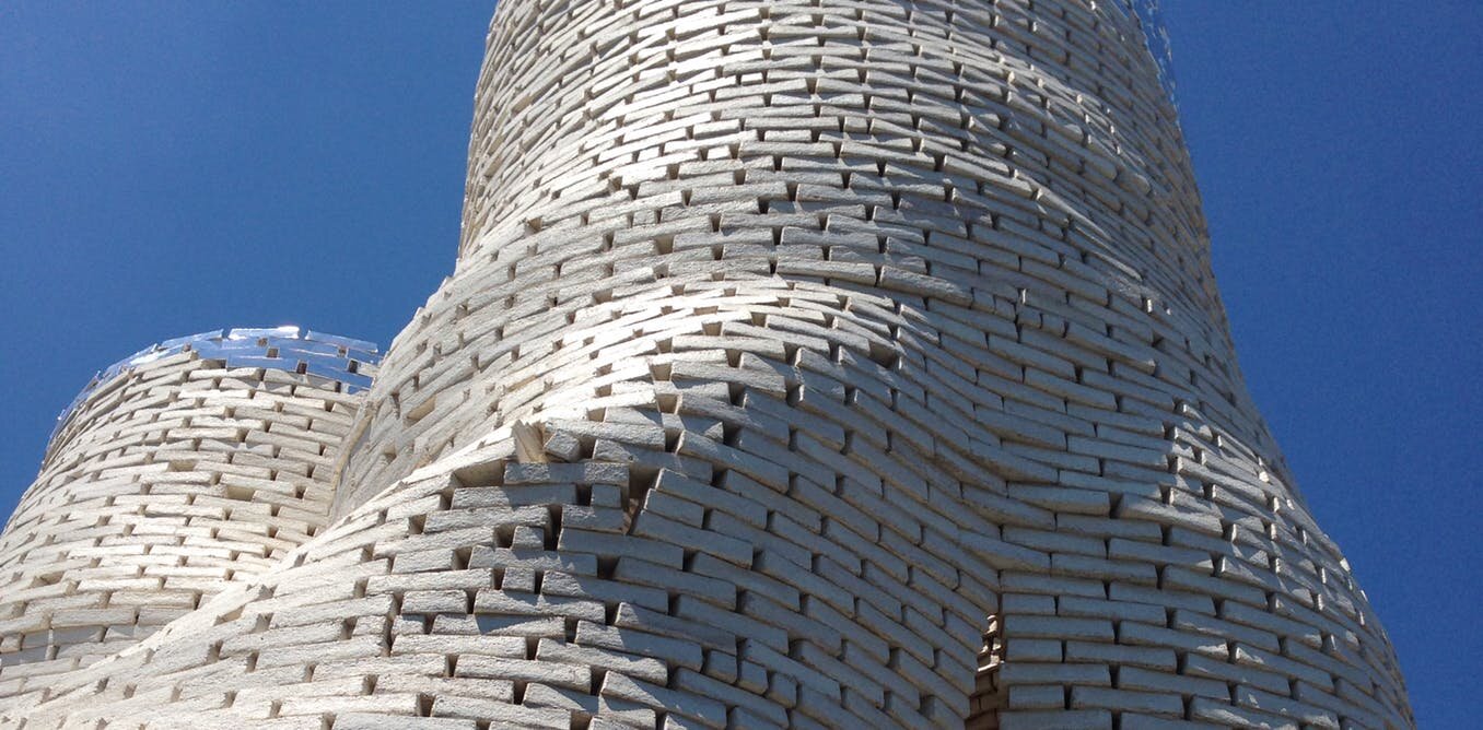 a tower of mycelium composite bricks at the MoMA in New York City